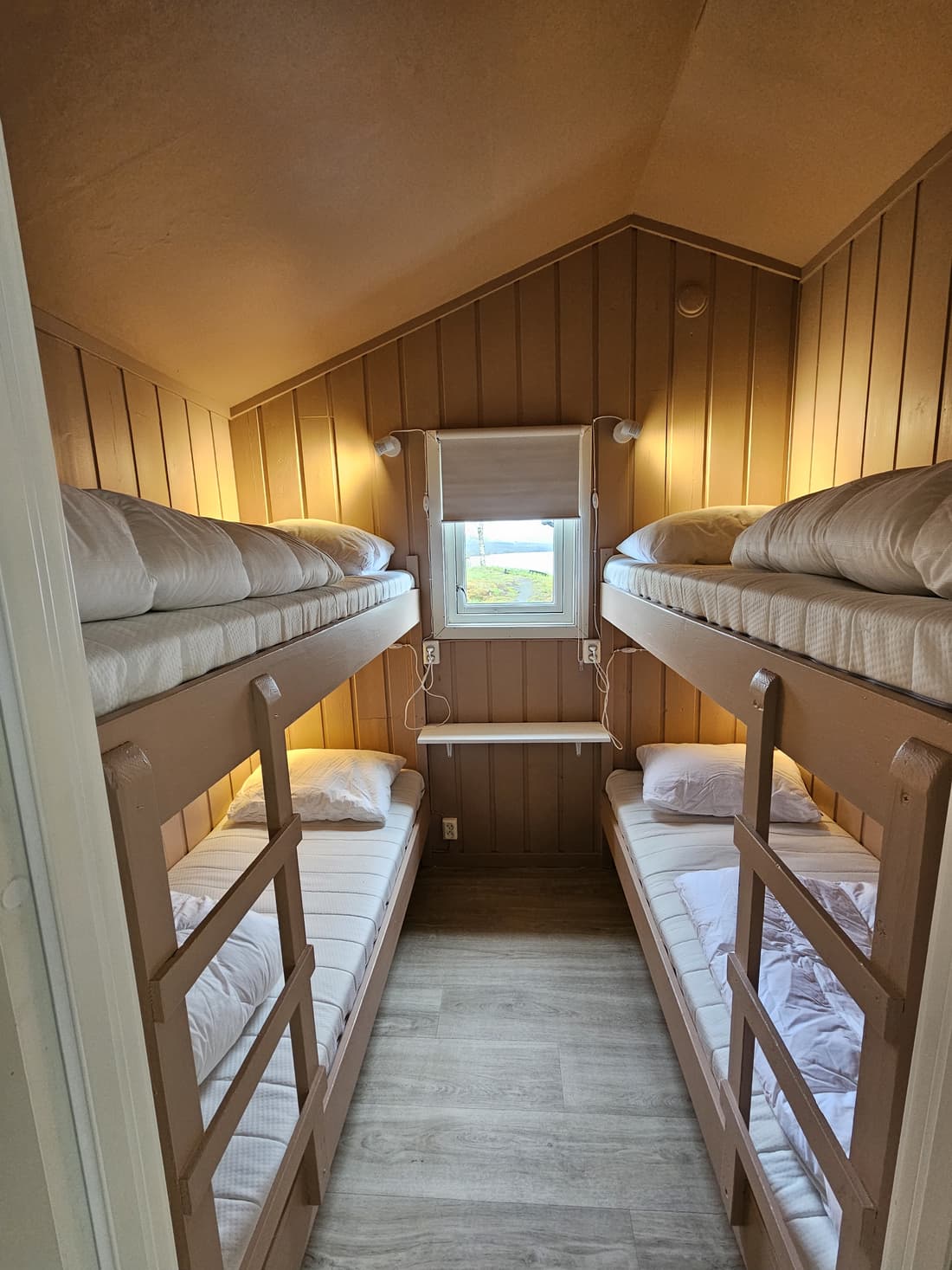 Bedroom in cabin 3 with bunk beds under the sloping ceiling